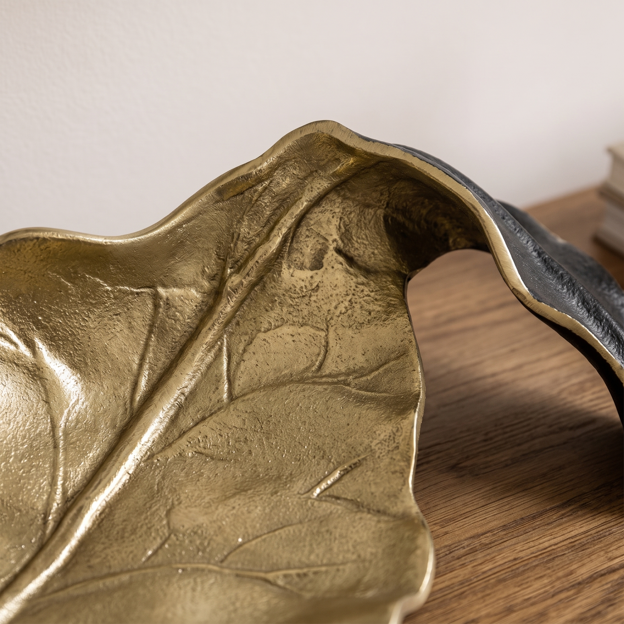 Close up of the raised vein casting and the antique gold to matte black edge of the Fern tray